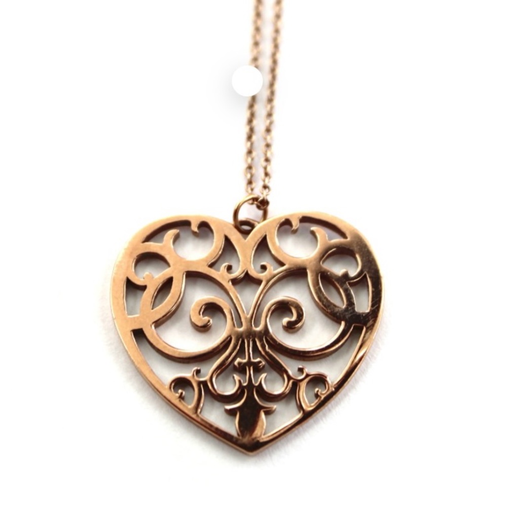 Tiffany and co rubedo metal (Rose gold color) enchant mini heart necklace.